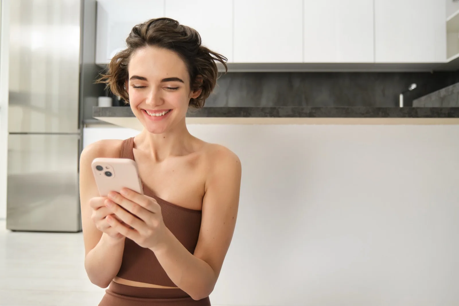 Customer completing a purchase via text on her phone